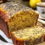 Moist and zesty lemon poppy seed loaf topped with a lemon glaze