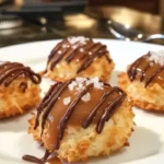 Delicious caramel coconut macaroon thumbprints on a baking tray
