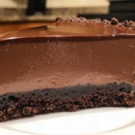 Delicious Chocolate Cheesecake No Water Bath topped with chocolate shavings