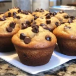Freshly baked chocolate chip muffins with gooey chocolate bits