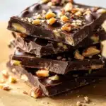 Homemade Date Snickers bars with dates, nuts, and chocolate drizzles.