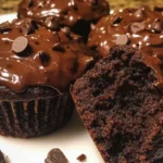 Delicious double chocolate muffins topped with chocolate chips