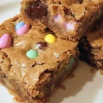 Easter Blondies with pastel-colored sprinkles and chocolate chunks on a white plate