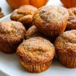 Freshly baked easy pumpkin muffins on a wooden table