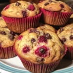 Jumbo raspberry chocolate chip muffins with fresh berries and chocolate chips.