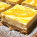 Delicious homemade Lemon Cheesecake Bars with a buttery crust and lemon zest topping.