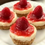 Delicious mini strawberry cheesecakes topped with fresh strawberries