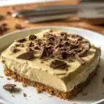 Delicious Peppermint Crisp Tart topped with chocolate and peppermint, perfect dessert.