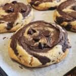 Soft-baked peanut butter chocolate swirl cookies on a plate