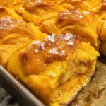 Homemade sweet potato rolls displayed on a plate