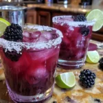 A delicious Blackberry Margarita garnished with fresh blackberries and lime.