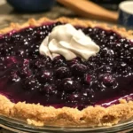 Delicious blueberry cream cheese pie with fresh blueberries and creamy filling.