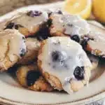 Freshly baked blueberry muffin cookies with blueberries on a wooden table