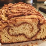 Freshly baked Cinnamon Crunch Bread with a golden crust and rich cinnamon flavor.