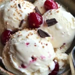 Delicious coconut milk ice cream served in a bowl with fresh coconut slices
