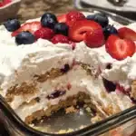 Delicious Easy Berry Icebox Cake with fresh berries and whipped cream layers