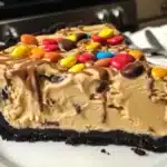 Delicious easy peanut butter ice cream pie topped with chocolate drizzle