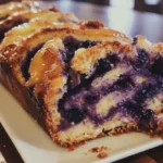 Freshly baked Lemon Blueberry Babka with lemon glaze and blueberries