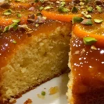 Moist flourless orange cake with cardamom and almond toppings
