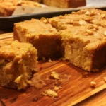 Delicious homemade peanut butter blondies on a wooden table