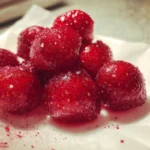 A close-up of Skittles Strawberries candies in vibrant colors.