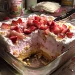 Delicious strawberry cheesecake lasagna layered with fresh strawberries and creamy filling