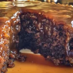 Warm sticky toffee cake with chopped dates and buttery toffee sauce