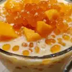 Delicious Mango Sago dessert topped with fresh mango and sago pearls