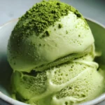 Delicious matcha ice cream served in a bowl with a scoop on top