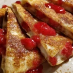 Strawberry cheesecake quesadilla with fresh strawberries and melted cheesecake filling